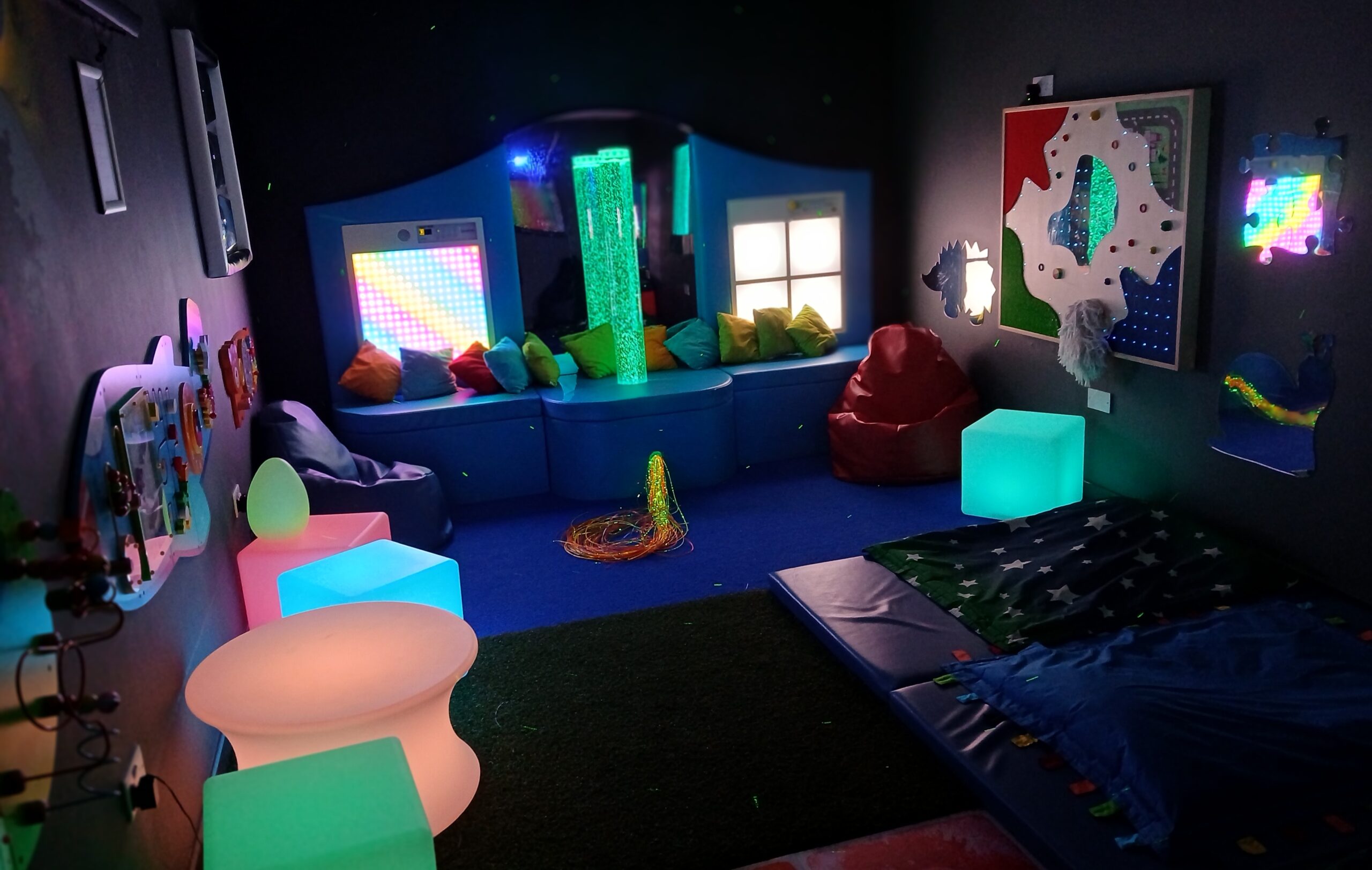 Soft lighting and sensory equipment in the Bounce n Beyond sensory room
